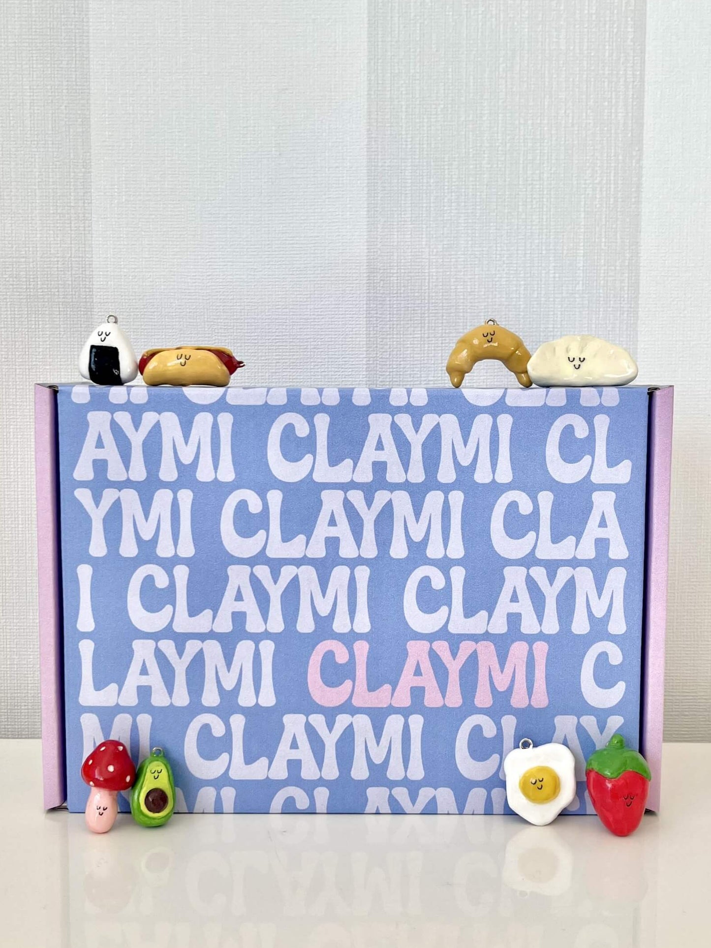 Complete air dry clay starter kit with everything needed to make your own cute clay charms – features colorful clay blocks, food-themed design inspiration, keychains, and crafting tools – ideal for beginners, kids, and DIY lovers looking for a fun, mess-free project.