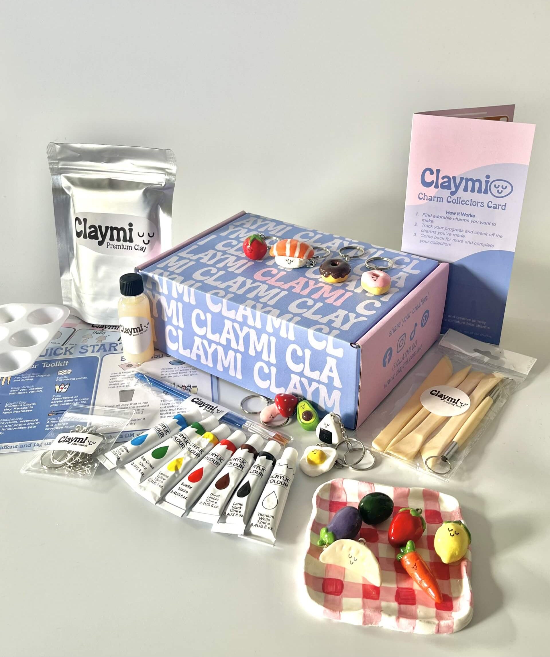 Claymi art supply kit with modeling clay, tools, and accessories on a white background